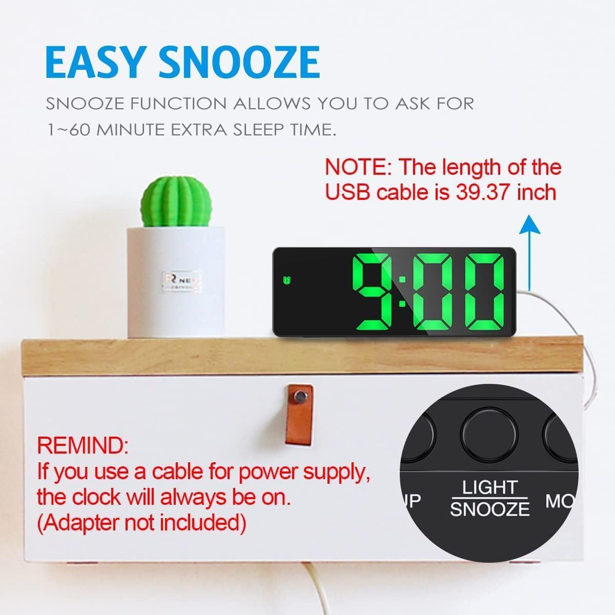 Digital clock with USB cable on a wooden shelf, featuring text about snooze function and USB cable length.