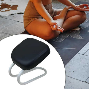 Person sitting on a yoga mat with a black and white kneeling pad inset.