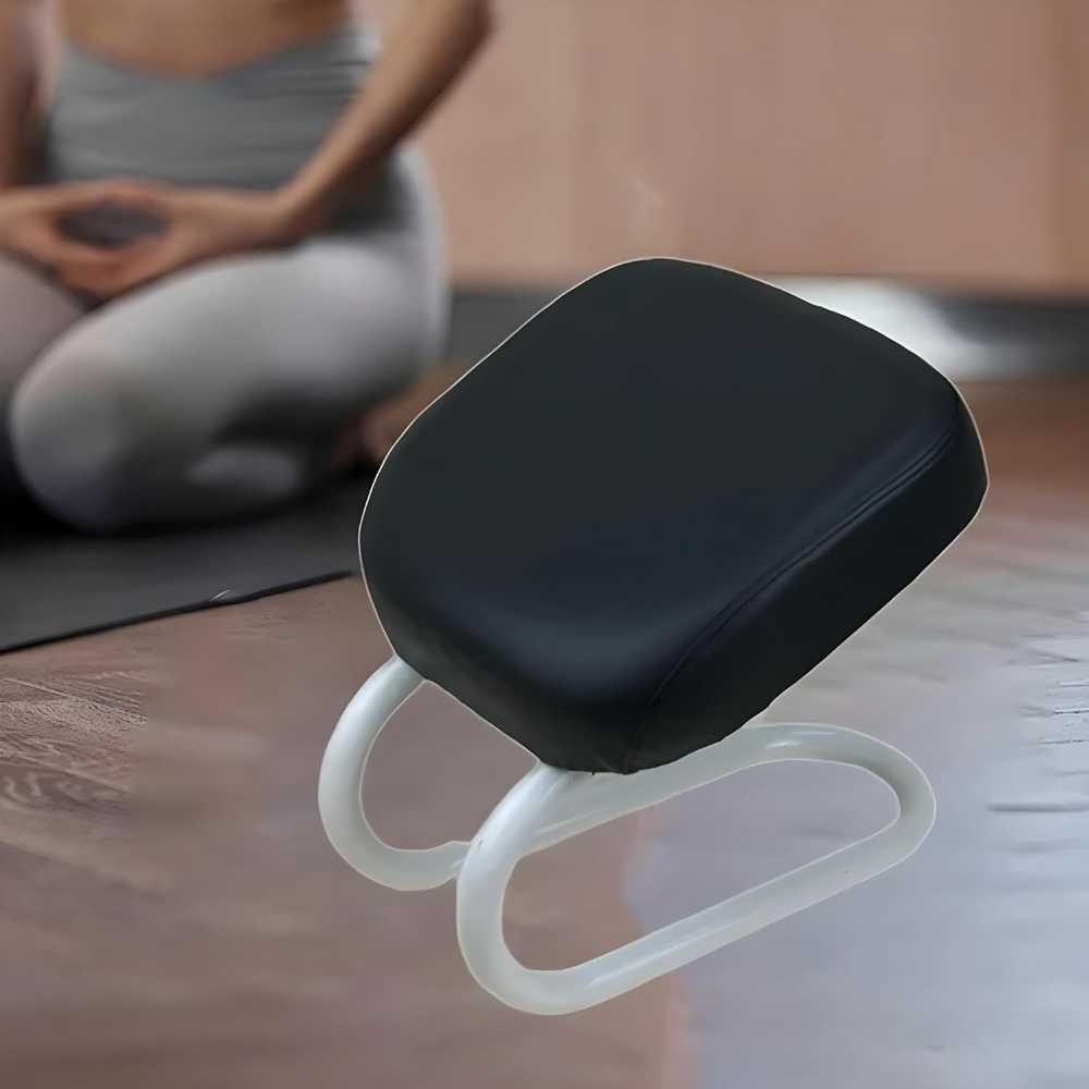 Black and white cushion on a wooden surface with a blurred person in the background.
