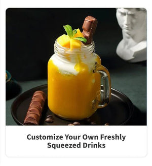 Mason jar with a layered drink, mango slices, and chocolate.