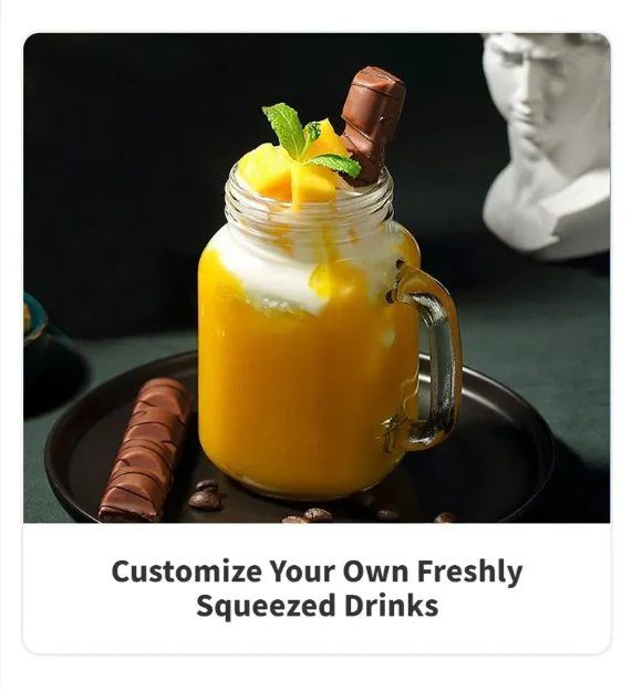 Mason jar with a layered drink, mango slices, and chocolate.