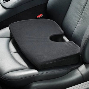 Black car seat cushion on a car seat