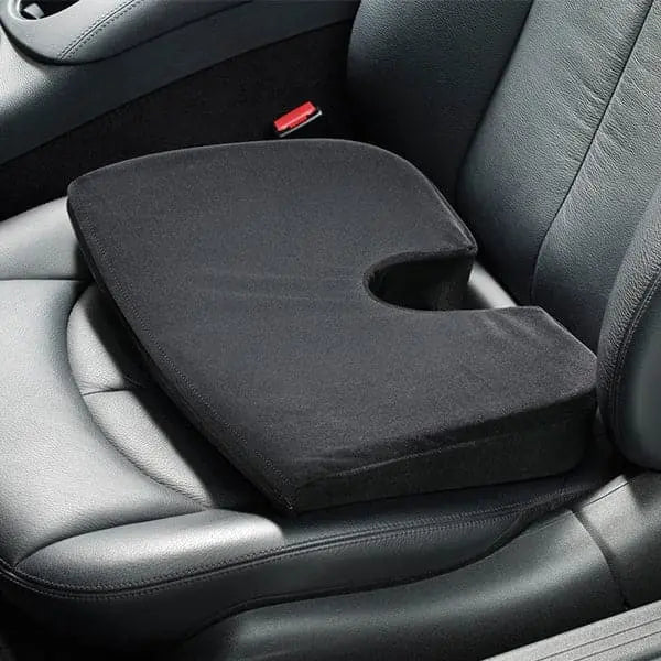 Black car seat cushion on a car seat