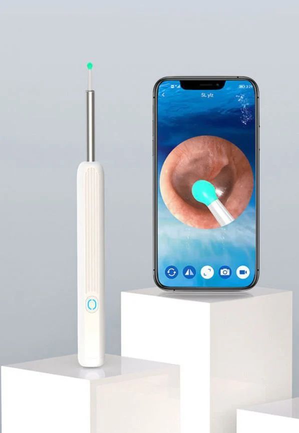 Ear cleaning tool with smartphone displaying ear inspection app on a light gray background